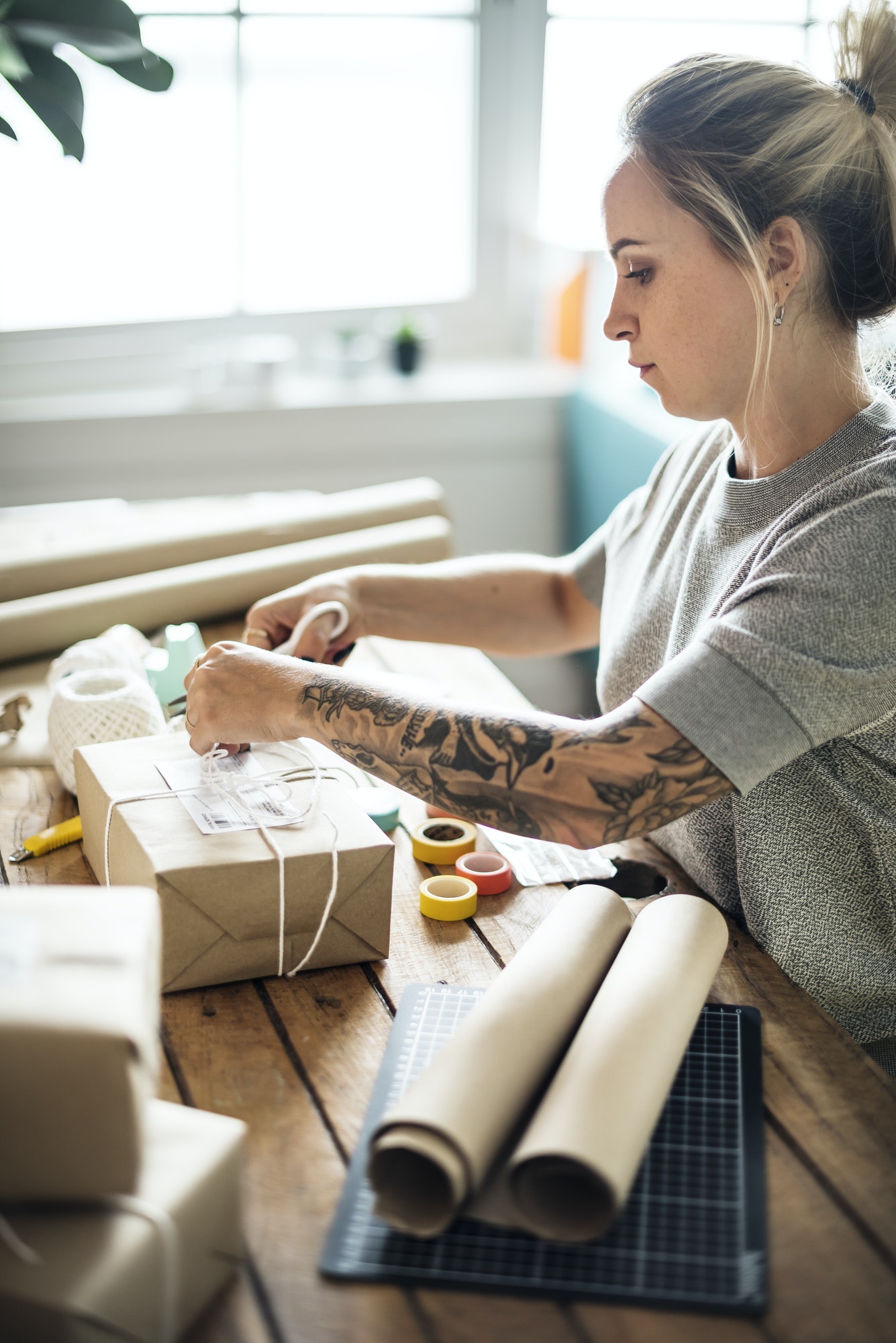 Woman packing parcel box