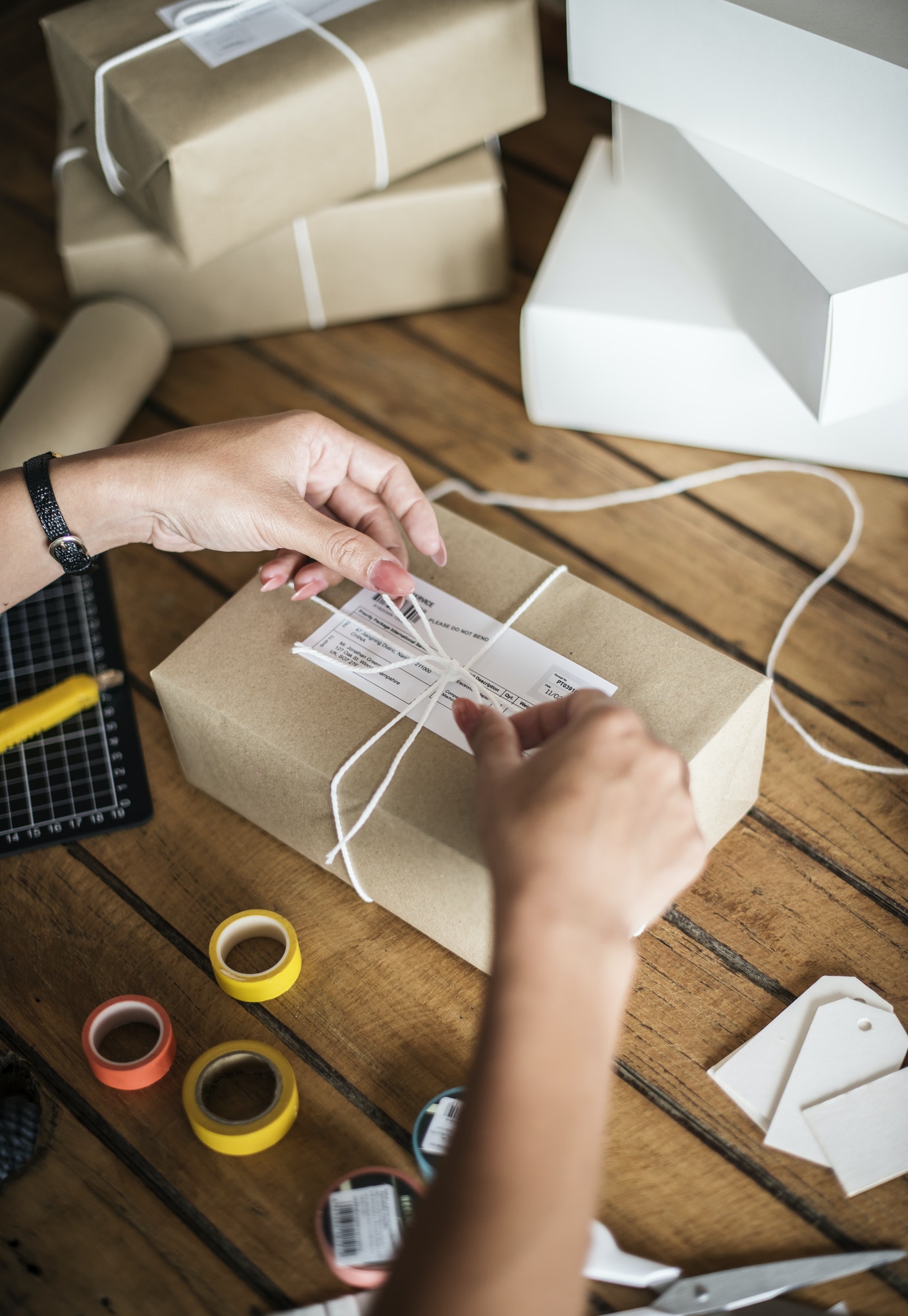 Woman packing parcels